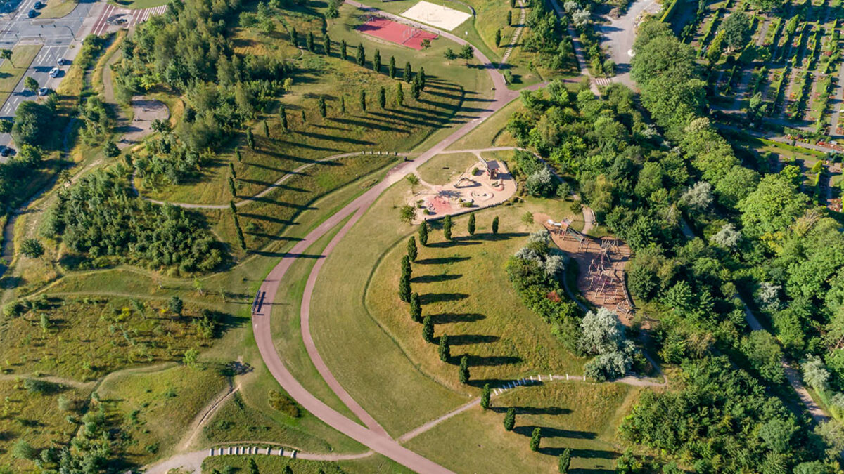 Landscape aerial view of the Krupp Park in Essen with winding path and trees in a picture by Ralph Richter