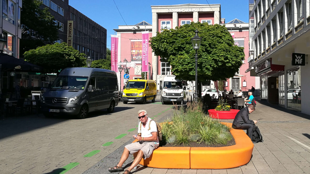 A photo showing a man sitting on tactical urbanism during Essen European Green Capital 2017