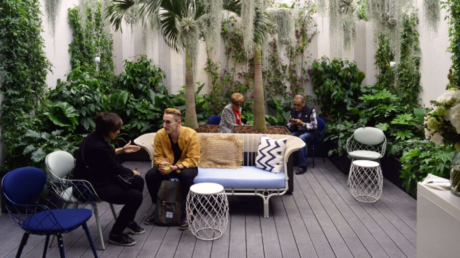 people sitting on a couch in a cozy room