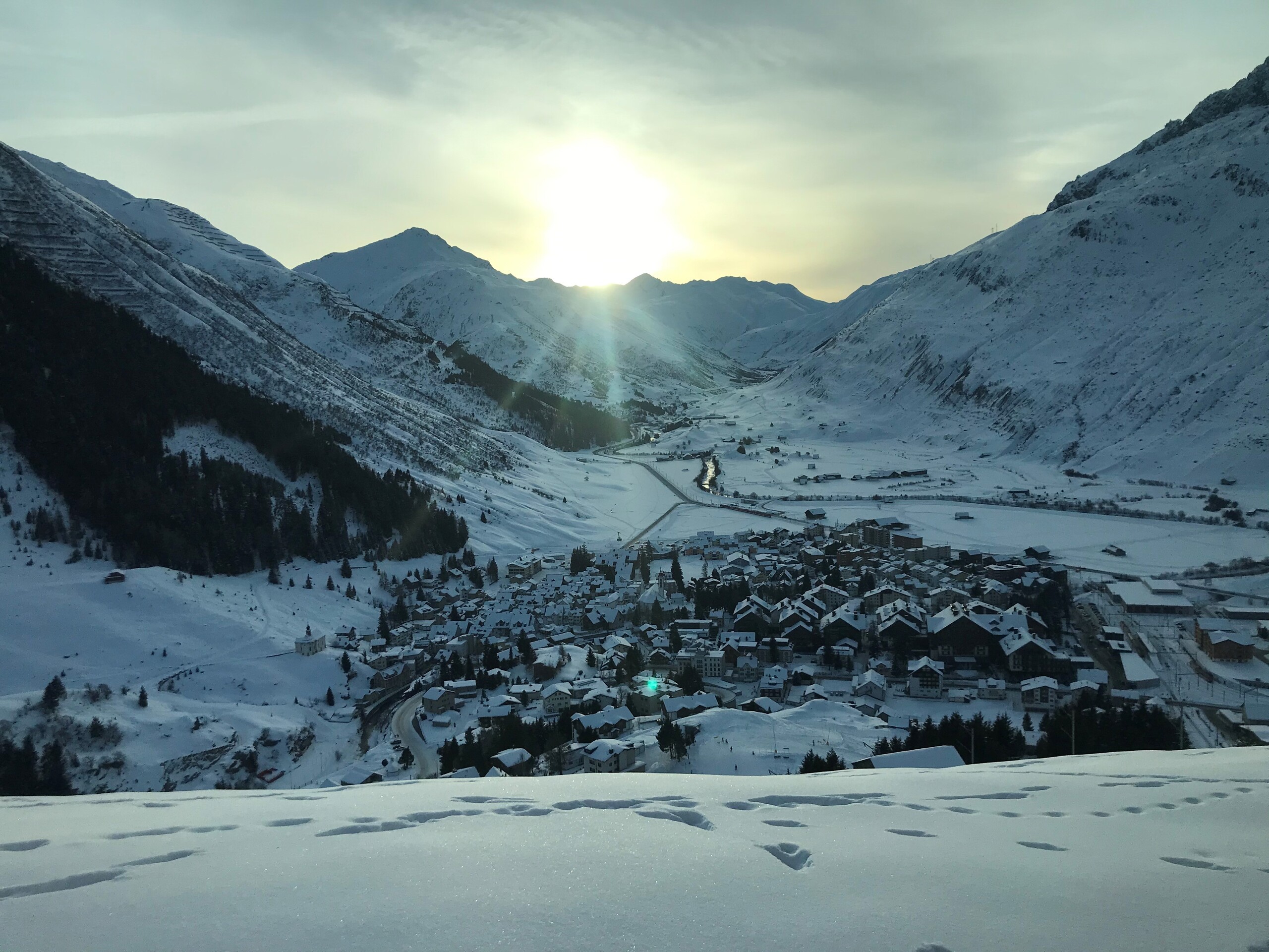 Alps with snow and a town in the valley