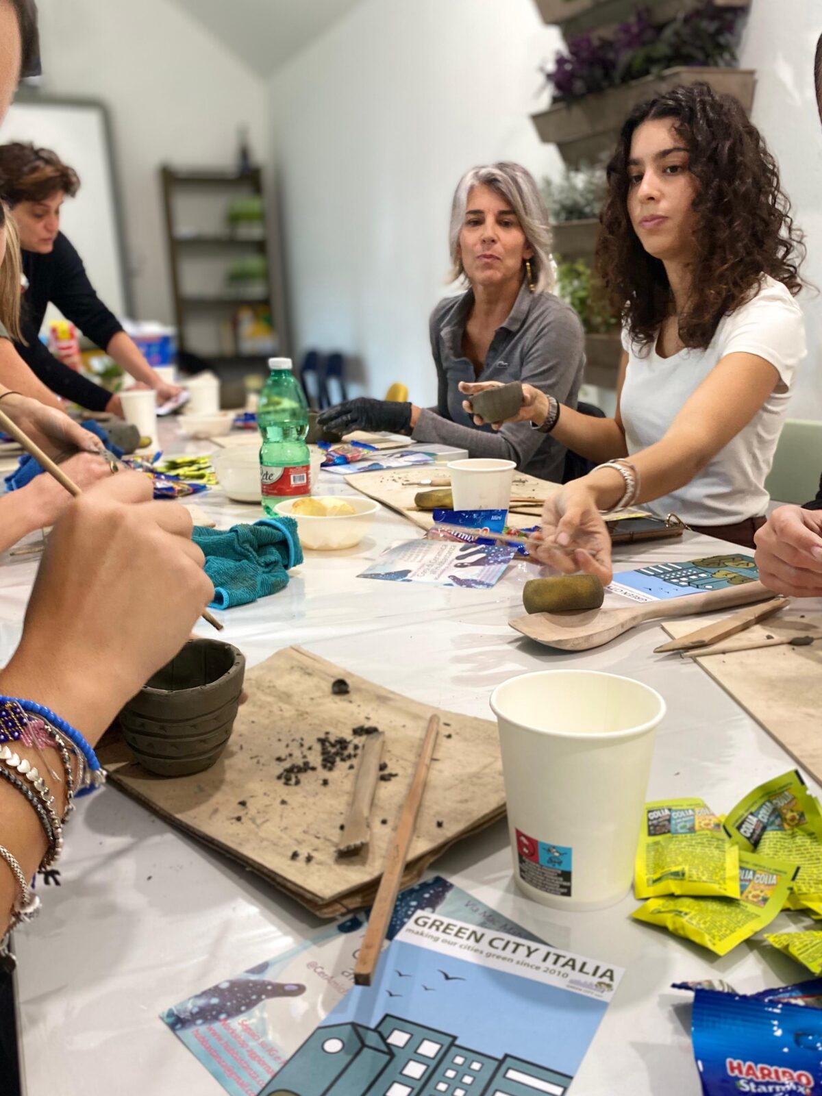 Women doing a pottery workshop