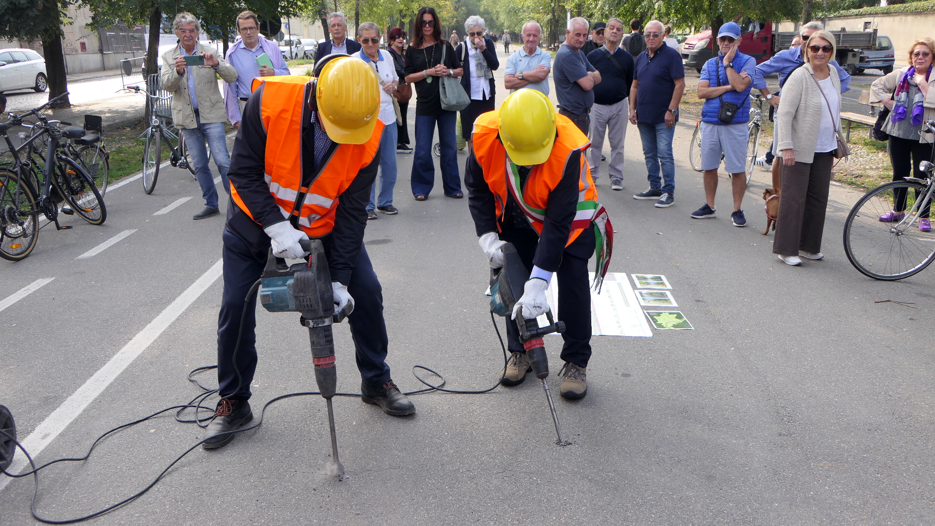 Two men using a drill