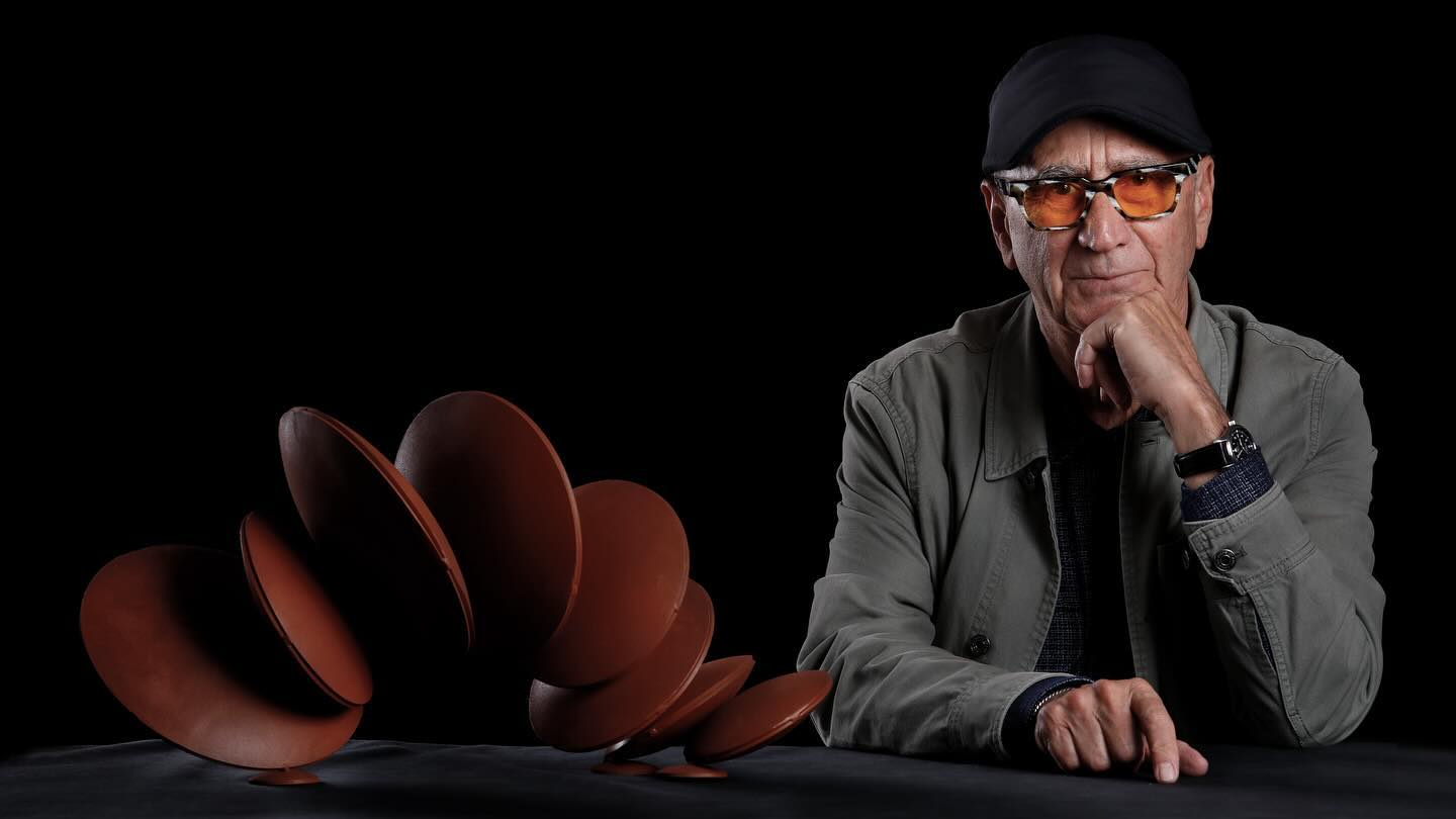 an artist sitting in front