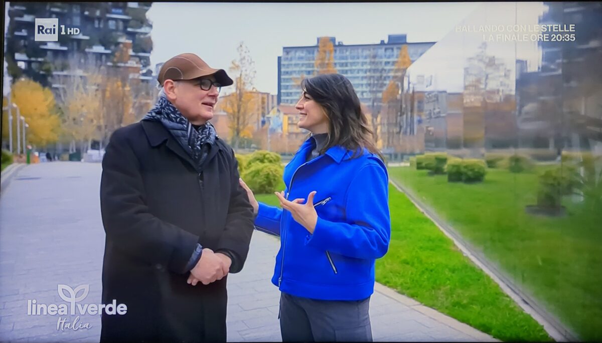 A man and a woman chatting on the street