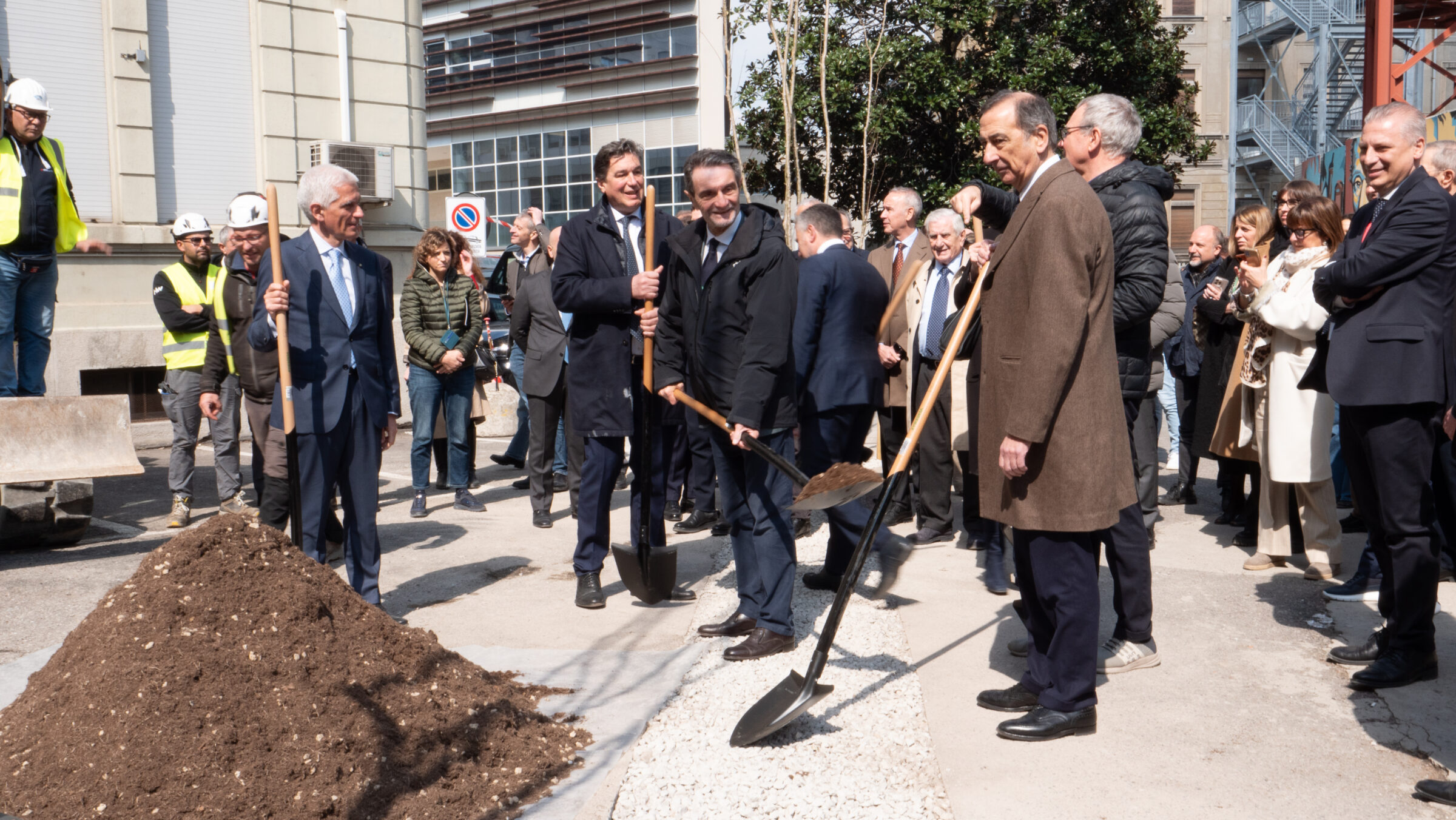 a group of people planting a tree
