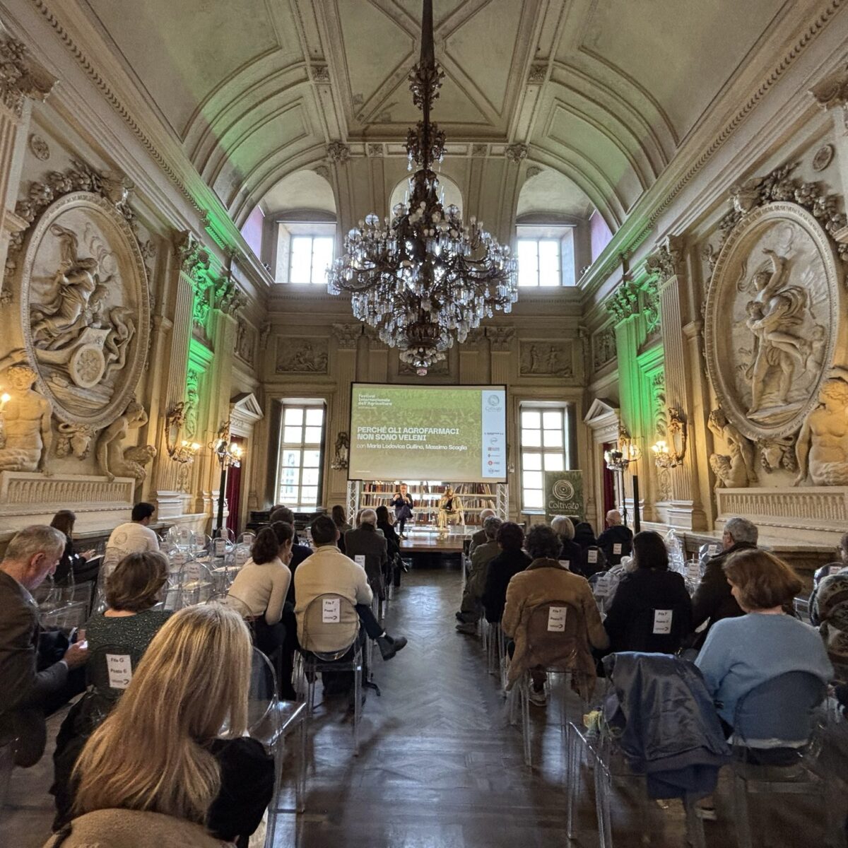 a room full of people attending a meeting