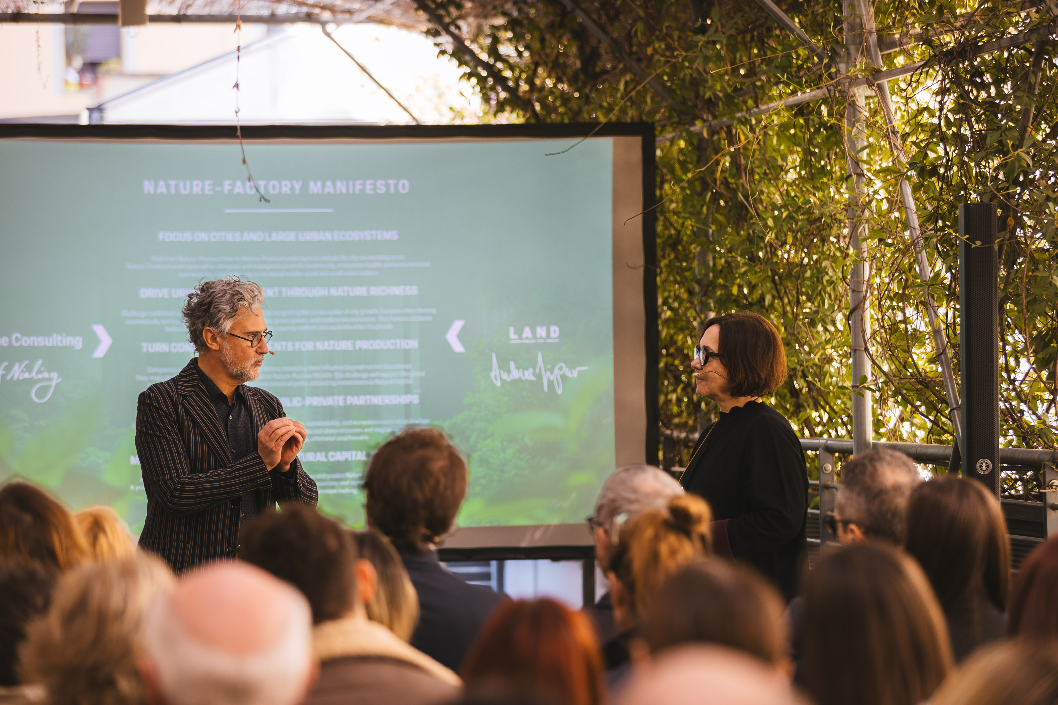 a man speaking at the microphone