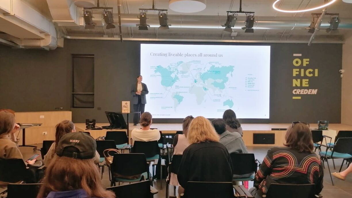 A woman speaking to an audience from a stage